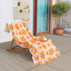 Vicky Yorke Summer Nostalgia beach draped neatly over a wooden lounge chair on a patio.