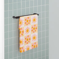 Vicky Yorke Summer Nostalgia beach draped neatly over a metal towel rod.