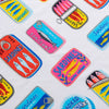 Close up of a Bex Morley Sardine Tin beach towel.