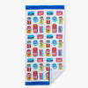 Bex Morley Sardine Tin beach towel laid flat on a white surface.