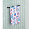 Close up of a Krissy Mast Sardine draped neatly over a metal towel holder in a bathroom.