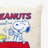 Peanuts Social Club Pillow on a white surface.