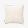 Back side of a Peanuts Social Club Pillow sitting on a white surface.