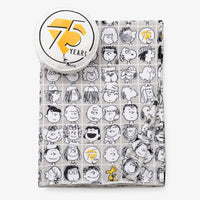 Peanuts 75th Anniversary Throw & Pillow Set on a white surface.