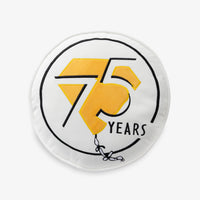 Peanuts 75th Anniversary Pillow on a white surface.
