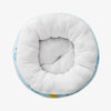 Overhead view of pet bed sitting on a white surface.