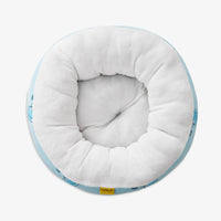Overhead view of pet bed sitting on a white surface.