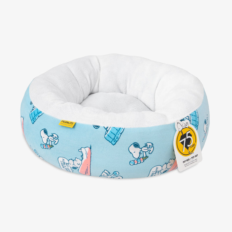 Peanuts pet bed sitting on a white surface.