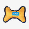 Peanuts dog toy sitting on a white surface.