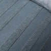 Close-up of a textured blue towel with a waffle pattern