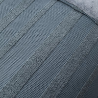 Close-up of a textured blue towel with a waffle pattern