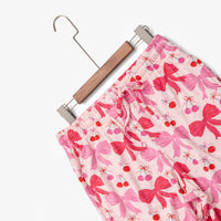 Krissy Mast printed lounge pants laid flat with a hanger on a white surface.