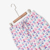 Krissy Mast printed lounge pants laid flat with a hanger on a white surface.