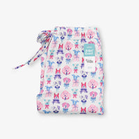 Krissy Mast printed lounge pants folded neatly on a white surface.