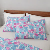 Krissy Mast floral printed comforter set pillowcases on a bed.