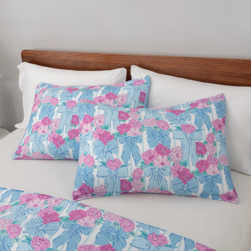 Krissy Mast floral printed comforter set pillowcases on a bed.