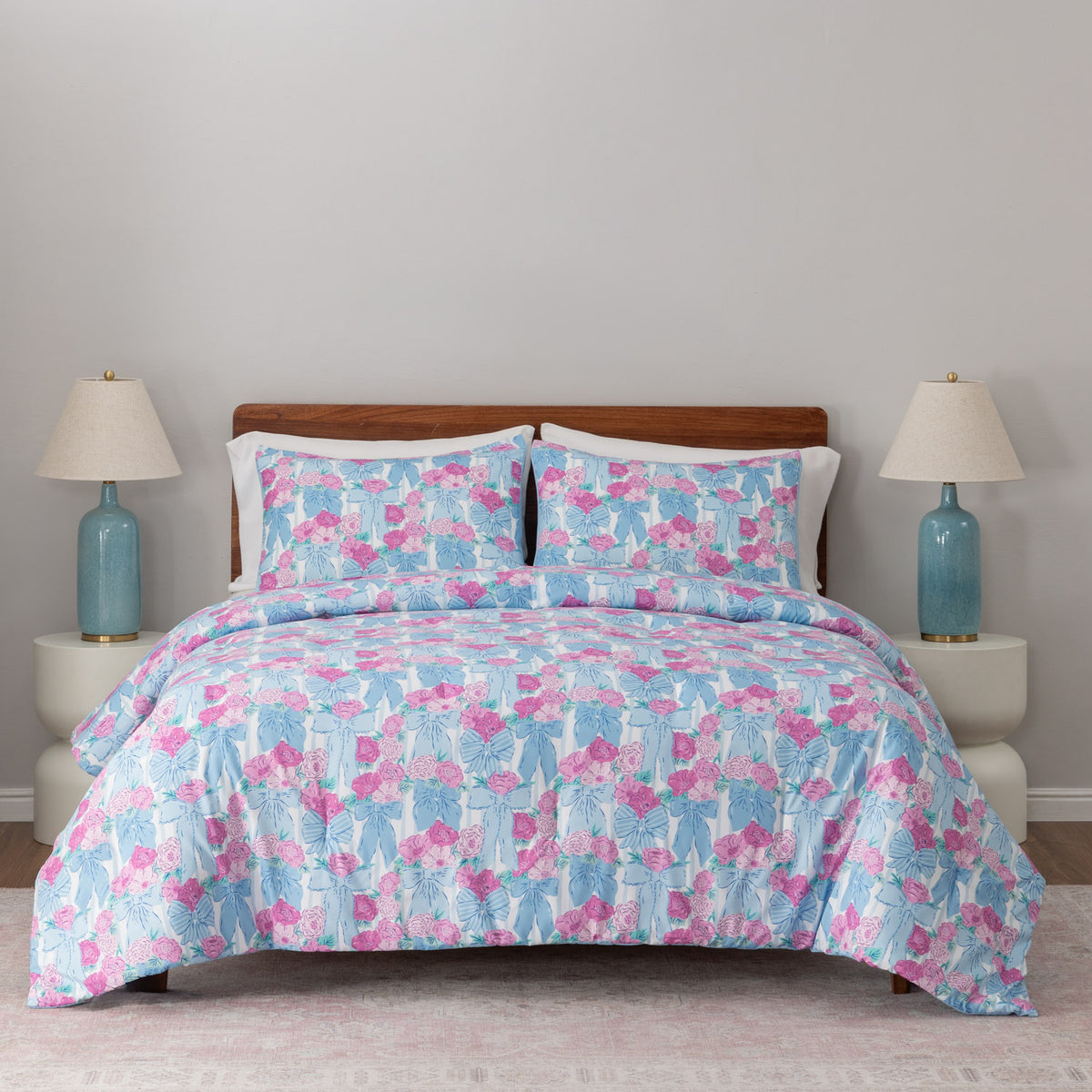 Krissy Mast floral printed comforter set decorated on a bed.