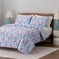 Krissy Mast floral printed comforter set dresed on a bed.