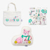 Set of products including a tote bag, pillow, and blankets with cartoon designs on a white background.