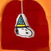 Plush toy with a wizard hat design on a red and orange background