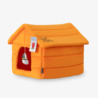 Orange pet house with a tag on a white background