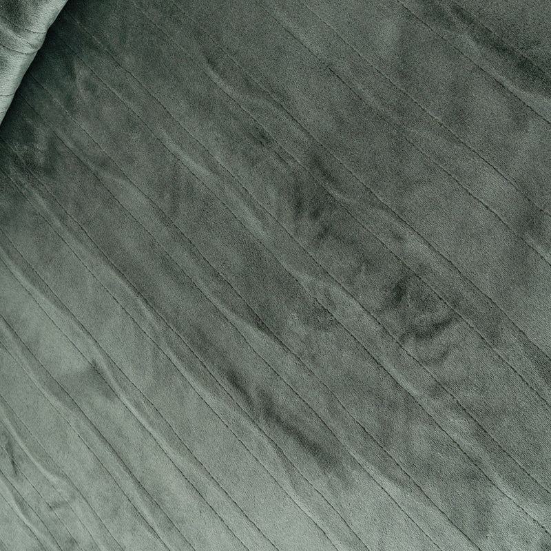 Close-up of textured green fabric with a subtle pattern