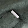 White connector on a textured green surface
