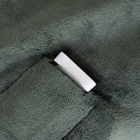 White connector on a textured green surface