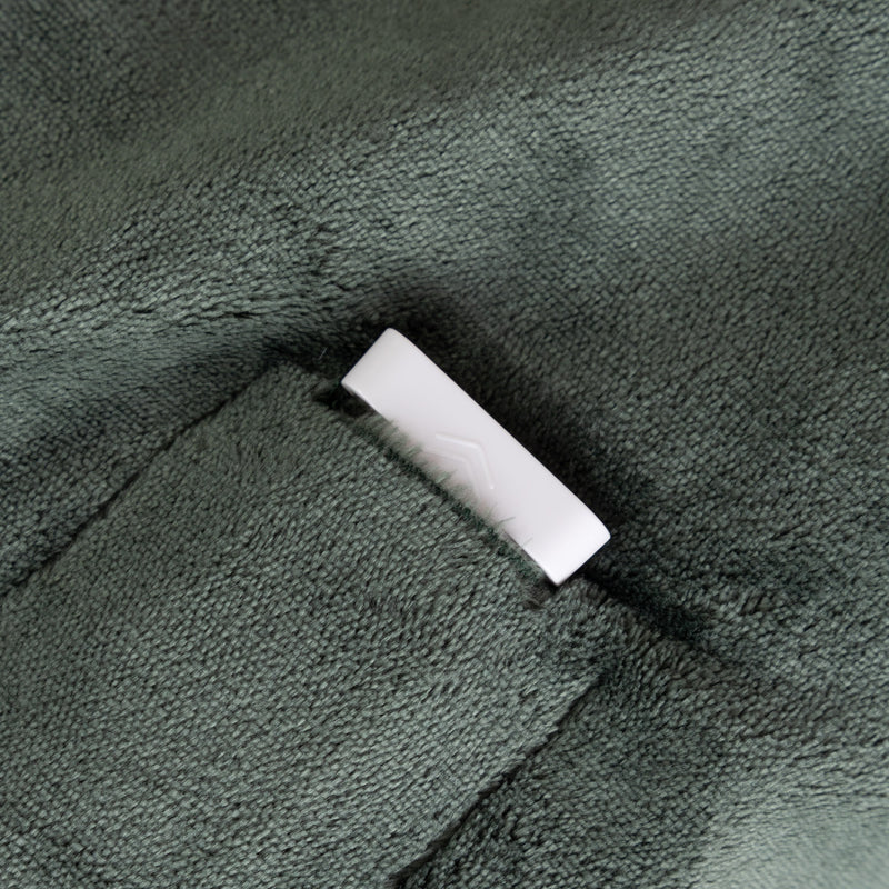 White connector on a textured green surface