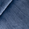 Close-up of blue fabric with a textured pattern