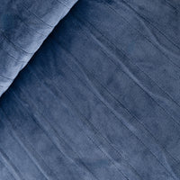 Close-up of blue fabric with a textured pattern