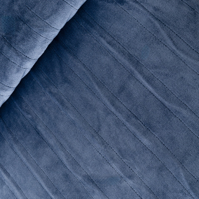 Close-up of blue fabric with a textured pattern