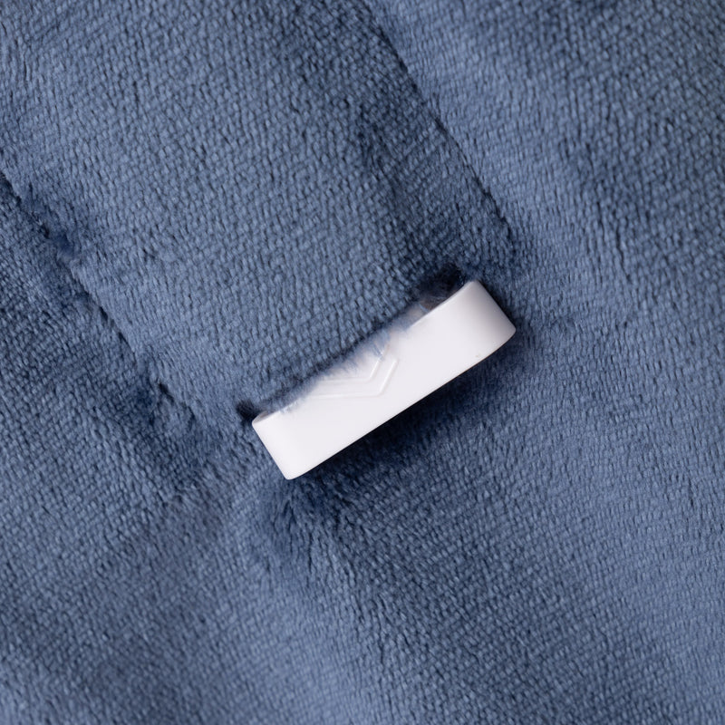 White connector on a textured blue surface