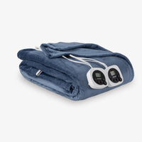 Folded electric blanket with control panels on a white background