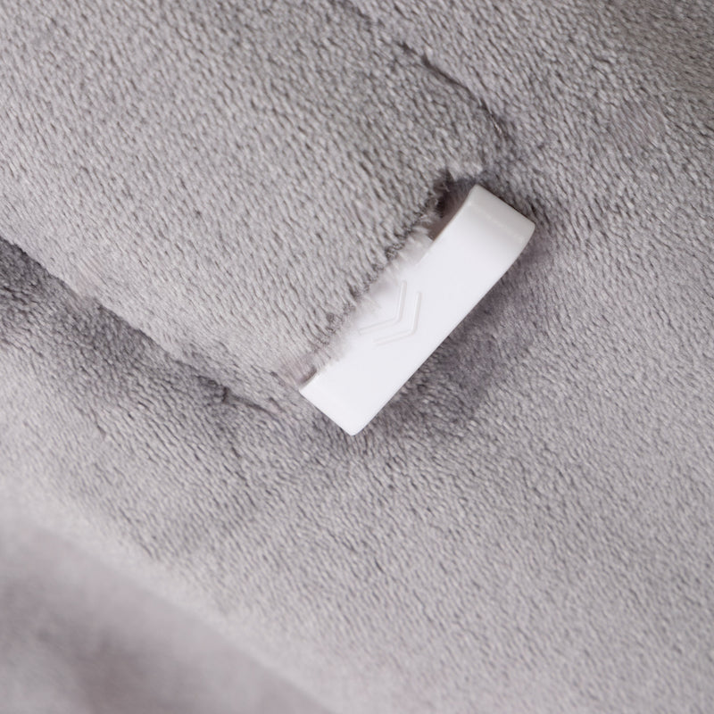 White connector on a textured gray surface