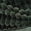 Close-up of dark green textured fabric with a pattern
