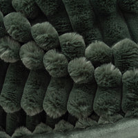 Close-up of dark green textured fabric with a pattern