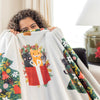 A women holding up a cat printed holiday throw.