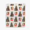 Woven placemat with Christmas tree and gift pattern on a white background