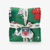 Folded Peanuts-themed fabric with a tag on a white background