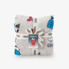Folded fabric with Peanuts character print on a white background
