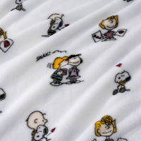 Close-up of fabric with cartoon character pattern on a white background
