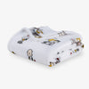 Folded blanket with cartoon character pattern on a white background