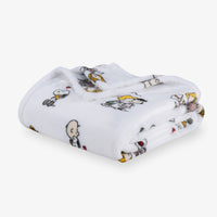 Folded blanket with cartoon character pattern on a white background