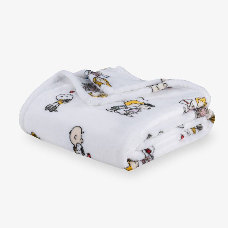Folded blanket with cartoon character pattern on a white background