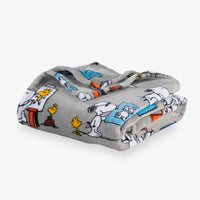 Folded blanket with cartoon character pattern on a white background