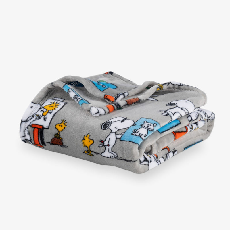 Folded blanket with cartoon character pattern on a white background