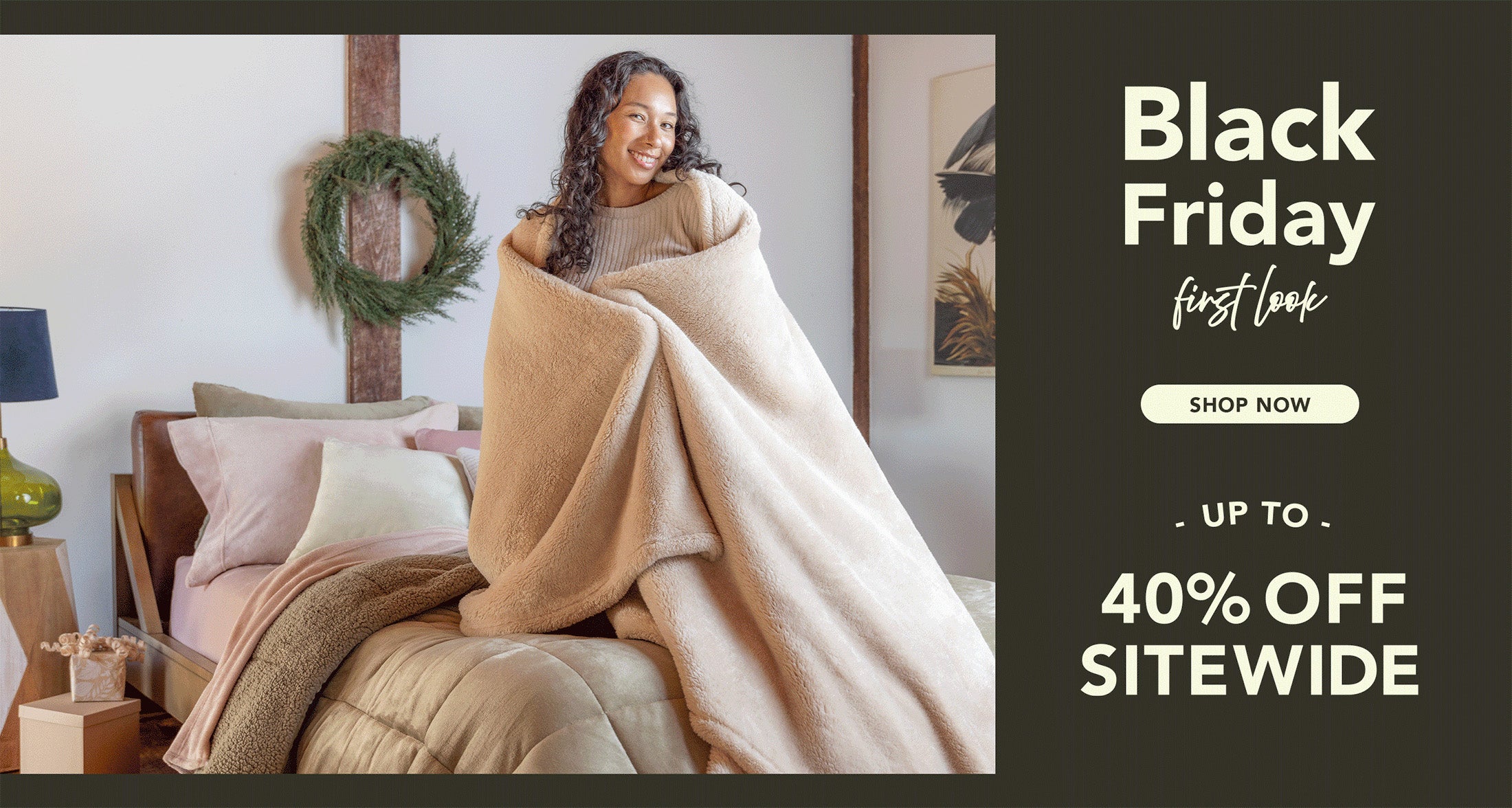 Black Friday First Look Shop Now Up to 40% OFF. Woman wrapped in blanket