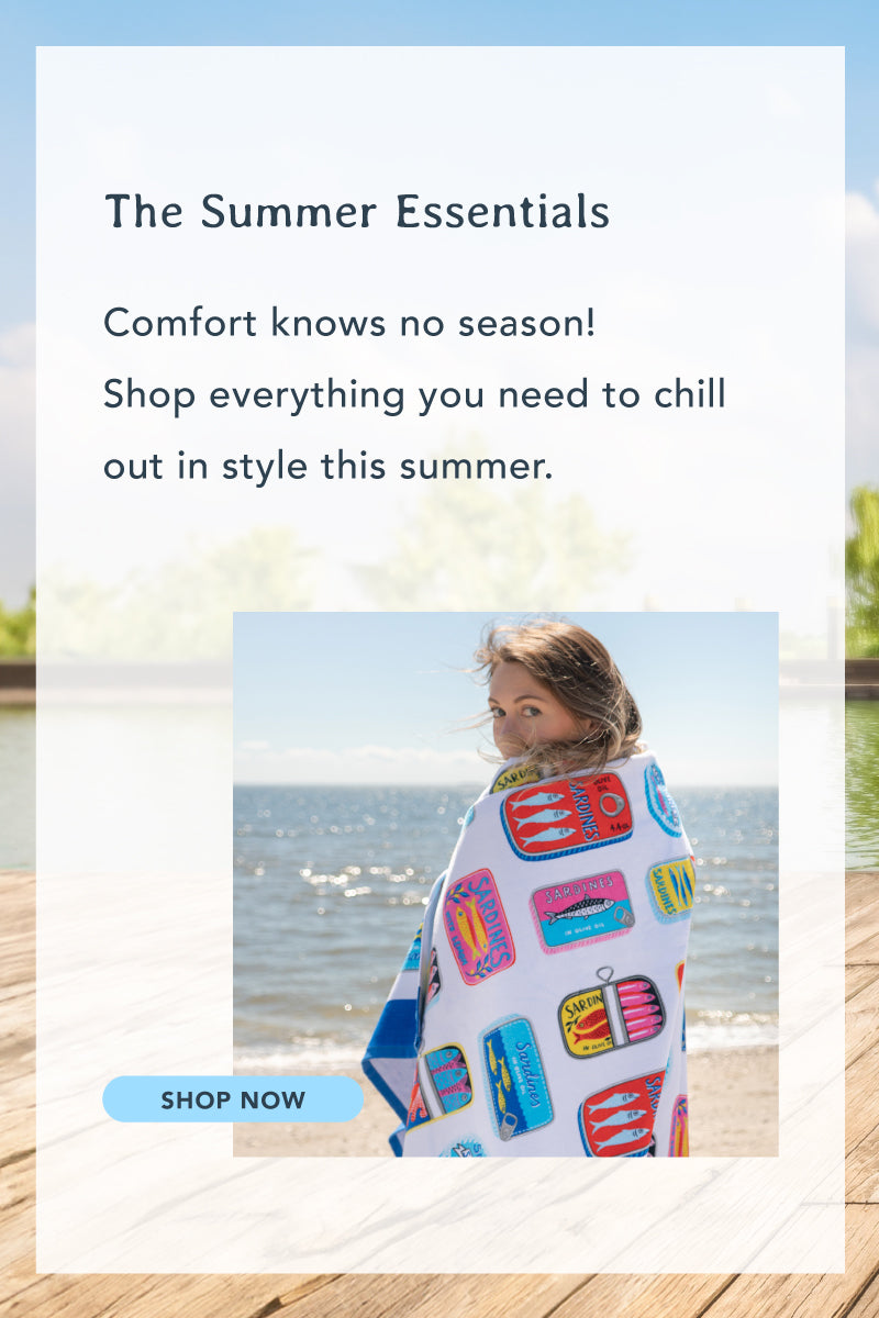 The summer essentials. Comfort knows no season! Shop everything you need to chill out in style this summer. Image of a girl at the beach wearing a towel.