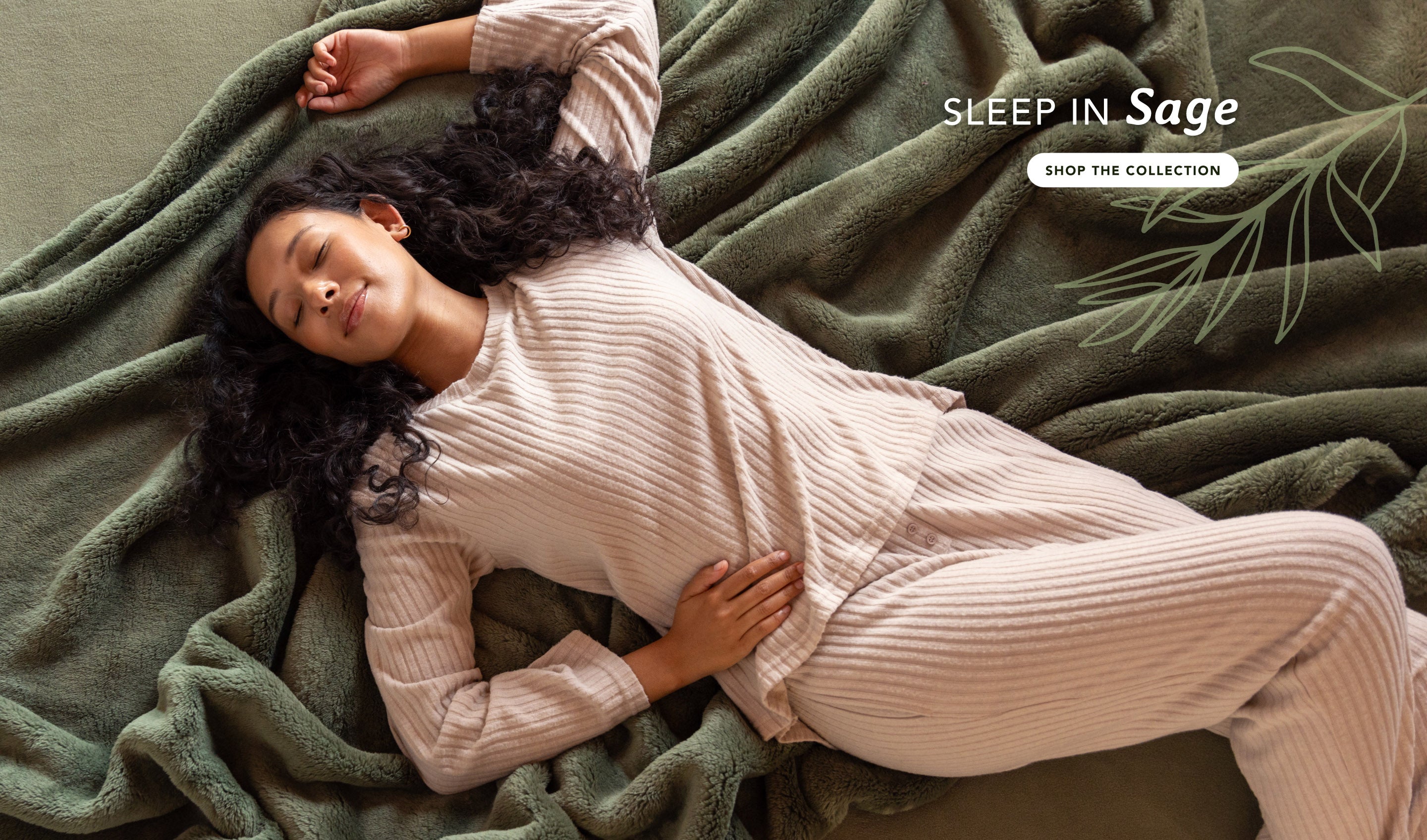 Sleep in sage theme banner featuring a woman laying on our green Extra-Fluffy blanket. Shop the collection now!